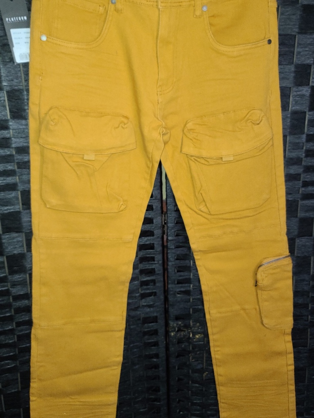 Mustard yellow multi-pocket stacked cargo jeans by the streetwear brand Platform